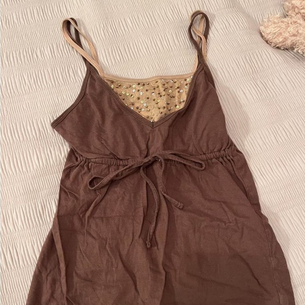 Double lined tank with chest sequence and tie around bust